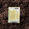 Back of Pumpkin - Mini Jack seed packet on garden soil