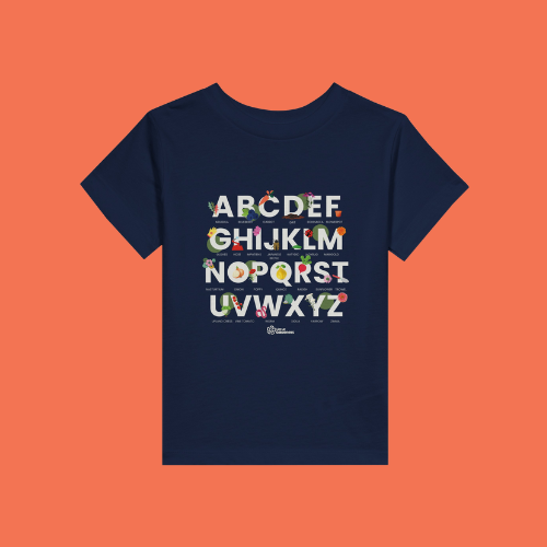 Little Gardeners Navy ABC Toddler T-Shirt featuring a colorful garden-themed ABC illustration on a soft cotton tee on an orange background.