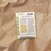 Back of Snap Sugar Daddy Organic seed packet on a kraft paper background