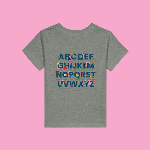 Little Gardeners Grey ABC Toddler T-Shirt featuring a colorful garden-themed ABC illustration on a soft cotton tee on a pink background